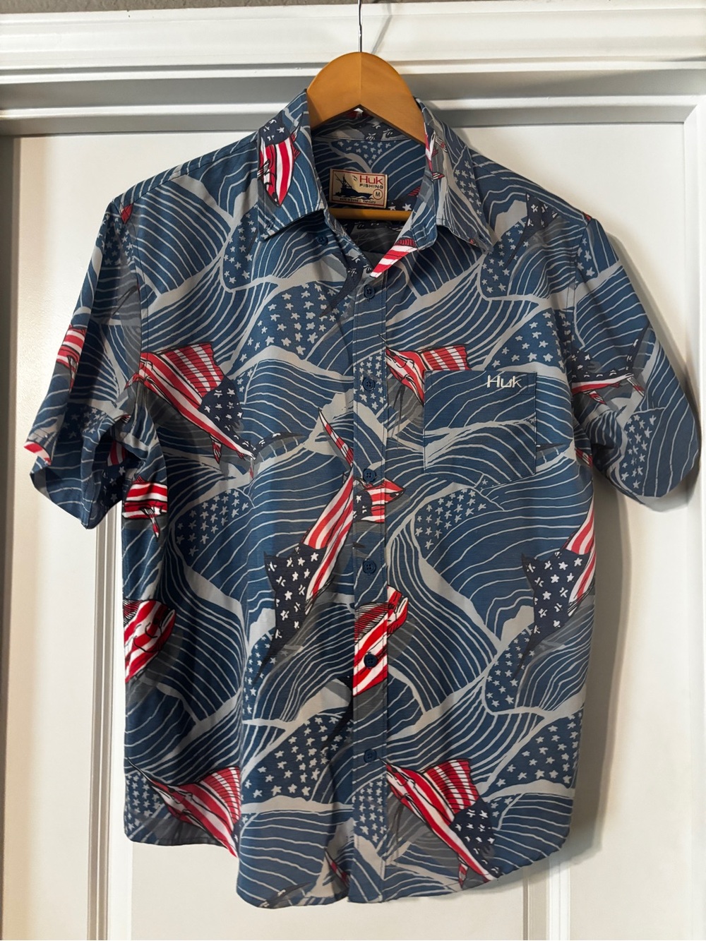 Huk Short Sleeve Button-Up Shirt in Blue with Red & White Flag Accents